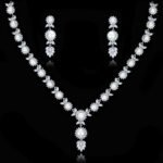 Wholesale floral pearl Y-necklace and earring set with platinum plating from JuneJewelry.com – elegant copper bridal fashion jewelry for bulk orders.