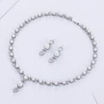 Wholesale floral pearl Y-necklace and earring set with platinum plating from JuneJewelry.com – elegant copper bridal fashion jewelry for bulk orders.