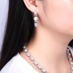 Wholesale floral pearl Y-necklace and earring set with platinum plating from JuneJewelry.com – elegant copper bridal fashion jewelry for bulk orders.