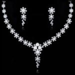 Wholesale floral pearl drop necklace and earring set with platinum plating from JuneJewelry.com – elegant copper bridal fashion jewelry for bulk orders.