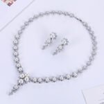 Wholesale floral pearl drop necklace and earring set with platinum plating from JuneJewelry.com – elegant copper bridal fashion jewelry for bulk orders.