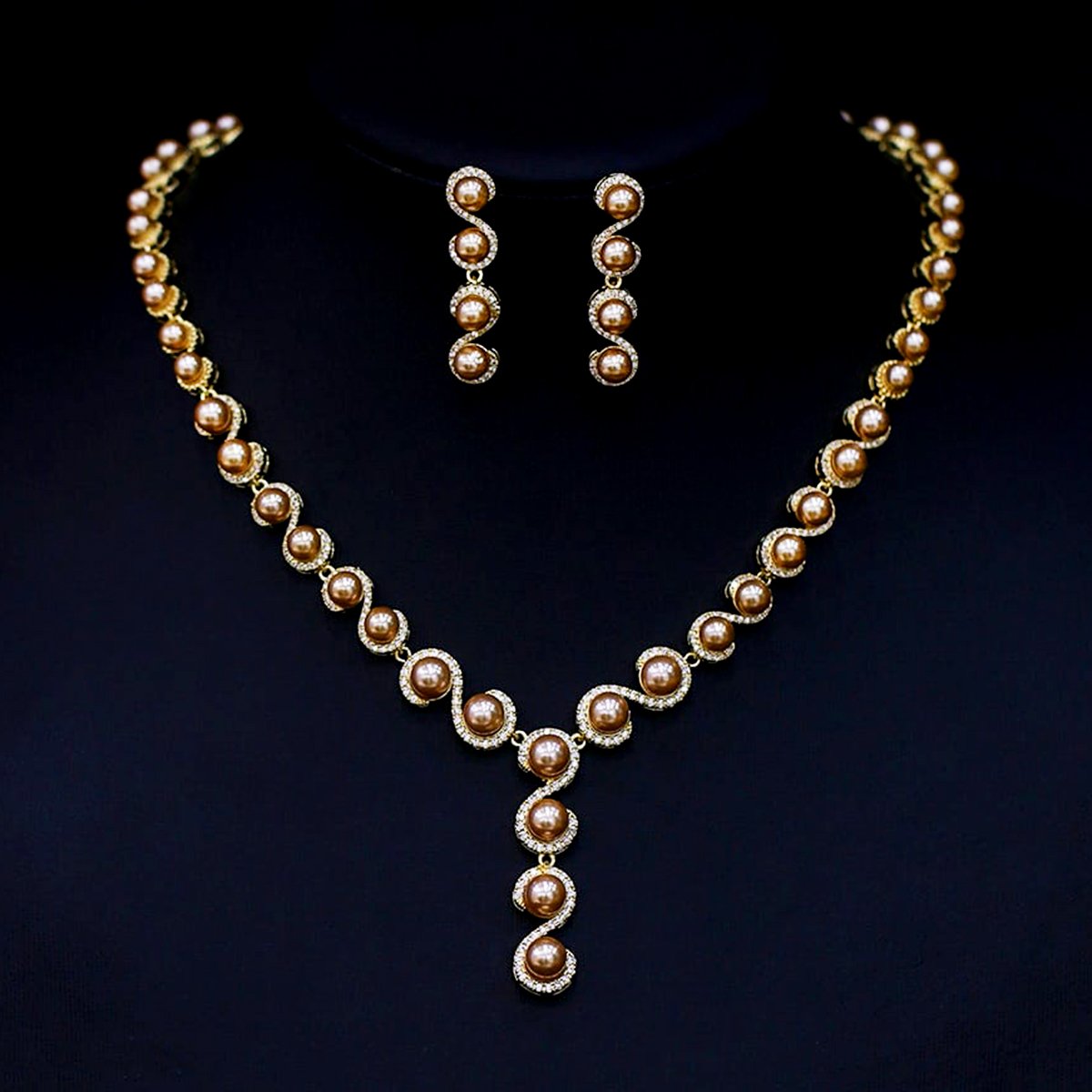 CN10458.457.A Wholesale golden pearl and wave motif necklace and earring set with platinum plating from JuneJewelry.com – luxurious copper fashion jewelry for bulk orders.