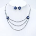 Wholesale bridal zircon jewelry set with multi-layered necklace and floral stud earrings. Platinum-plated copper set for weddings and formal wear from Junejewelry.com.