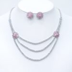 Wholesale bridal zircon jewelry set with multi-layered necklace and floral stud earrings. Platinum-plated copper set for weddings and formal wear from Junejewelry.com.