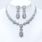 Wholesale teardrop halo necklace and earring set with platinum plating from JuneJewelry.com – dramatic copper fashion jewelry for bulk orders.