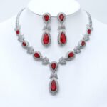 Wholesale teardrop halo necklace and earring set with platinum plating from JuneJewelry.com – dramatic copper fashion jewelry for bulk orders.
