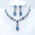 Wholesale teardrop halo necklace and earring set with platinum plating from JuneJewelry.com – dramatic copper fashion jewelry for bulk orders.