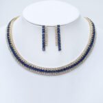 Make a dramatic statement with our wholesale triple row collar set, meticulously crafted from high-quality copper and lustrously gold-plated for magnificent sparkle. This original and unique design features a wide, multi-row necklace of dazzling square-cut stones and a pair of elegant, cascading drop earrings with baguette stones, creating a captivating and luxurious aesthetic. Ideal for boutiques, online jewelry stores, and cross-border eCommerce sellers, this set is perfect for customers seeking sophisticated, high-quality accessories. Benefit from our competitive factory-direct pricing and enjoy free worldwide shipping, ensuring exceptional value and profitability for all your bulk purchases at JuneJewelry.com.