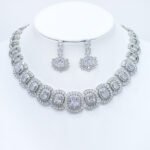 Wholesale cushion-cut halo collar necklace and earring set with platinum plating from JuneJewelry.com – opulent copper fashion jewelry for bulk orders.