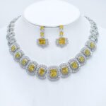 Wholesale cushion-cut halo collar necklace and earring set with platinum plating from JuneJewelry.com – opulent copper fashion jewelry for bulk orders.