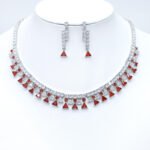 Wholesale cubic zirconia set with platinum plated brass. Double-row necklace with triangle drops and matching geometric drop earrings.