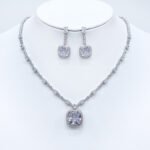 Wholesale cushion-cut halo necklace and earring set with platinum plating from JuneJewelry.com – luxurious copper fashion jewelry for bulk orders.