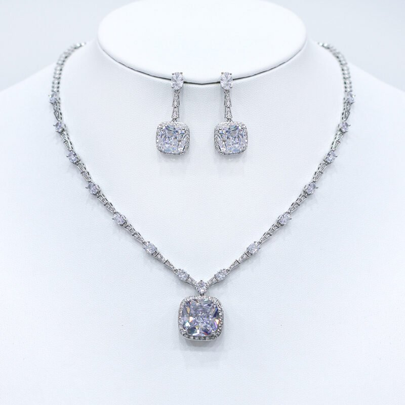 Wholesale cushion-cut halo necklace and earring set with platinum plating from JuneJewelry.com – luxurious copper fashion jewelry for bulk orders.