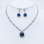 Wholesale cushion-cut halo necklace and earring set with platinum plating from JuneJewelry.com – luxurious copper fashion jewelry for bulk orders.