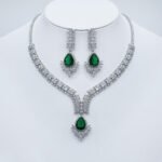 Wholesale bridal zircon jewelry set with pear-shaped stones. Platinum-plated brass necklace and earrings for special occasions from JuneJewelry.com.