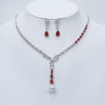 Wholesale platinum plated set with pearl and zirconia. Brass Y-shaped necklace and matching drop earrings for bridal wear.