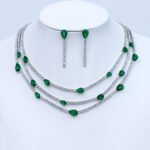 Wholesale layered zircon necklace set with teardrop stones, platinum plated on copper, and matching linear earrings from JuneJewelry.com – modern fashion jewelry for bulk buyers.