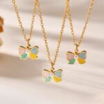 Wholesale kids bow jewelry set – 18K gold plated stainless steel necklace, bracelet, earrings, and ring with colorful drip oil enamel.