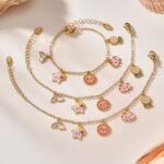 Wholesale kids charm jewelry set with sun, star, and cloud enamel in 18K gold plated stainless steel – necklace, bracelet, and anklet.