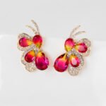 Wholesale butterfly stud earrings with pink and green multi-color zirconia and 925 silver needles from JuneJewelry.com.