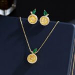 Wholesale lemon jewelry set with necklace and earrings in 18K gold plating – cute, fresh fashion accessories from JuneJewelry.com.