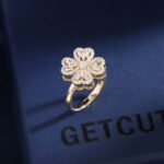 Rotatable Clover Heart Jewelry Set for women, 18K gold plated copper, featuring a transforming heart/four-leaf clover design on earrings, ring, and flower choker necklace, a unique, light luxury wholesale item from junejewelry.com.