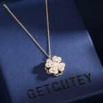 Rotatable Clover Heart Jewelry Set for women, 18K gold plated copper, featuring a transforming heart/four-leaf clover design on earrings, ring, and flower choker necklace, a unique, light luxury wholesale item from junejewelry.com.