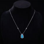 Wholesale Blue Zircon Gourd Set (Hulu shape), featuring copper plated with white gold, micro-pave vibrant blue zircon stones, gourd stud earrings, and a simple versatile neck chainand ring, a light luxury colorful set from junejewelry.com