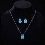 Wholesale Blue Zircon Gourd Set (Hulu shape), featuring copper plated with white gold, micro-pave vibrant blue zircon stones, gourd stud earrings, and a simple versatile neck chainand ring, a light luxury colorful set from junejewelry.com