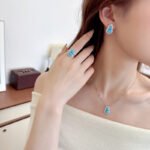 Wholesale Blue Zircon Gourd Set (Hulu shape), featuring copper plated with white gold, micro-pave vibrant blue zircon stones, gourd stud earrings, and a simple versatile neck chainand ring, a light luxury colorful set from junejewelry.com