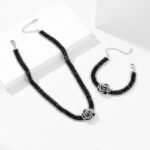 Wholesale Black Camellia Zircon Jewelry Set for women, featuring a black zircon flower choker and a vintage black camellia necklace and bracelet, made from white gold plated copper, emphasizing a high-end, light luxury aesthetic from junejewelry.com.