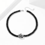 Wholesale Black Camellia Zircon Jewelry Set for women, featuring a black zircon flower choker and a vintage black camellia necklace and bracelet, made from white gold plated copper, emphasizing a high-end, light luxury aesthetic from junejewelry.com.