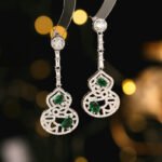 Wholesale hollow gourd zircon jewelry set with necklace and earrings in white gold plating – elegant floral hollow design from JuneJewelry.com.