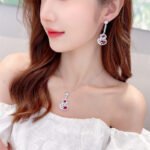 Wholesale hollow gourd zircon jewelry set with necklace and earrings in white gold plating – elegant floral hollow design from JuneJewelry.com.