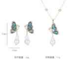 Abalone Shell Butterfly Pearl Jewelry Set in gold plating. The necklace and drop earrings feature a butterfly pendant with rainbow abalone shell wings and a dangling baroque freshwater pearl.