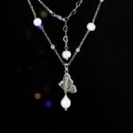 Abalone Shell Butterfly Pearl Jewelry Set in gold plating. The necklace and drop earrings feature a butterfly pendant with rainbow abalone shell wings and a dangling baroque freshwater pearl.