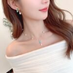 Abalone Shell Butterfly Pearl Jewelry Set in gold plating. The necklace and drop earrings feature a butterfly pendant with rainbow abalone shell wings and a dangling baroque freshwater pearl.