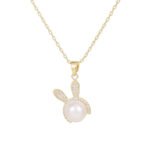 Wholesale Cute Rabbit Pearl Set in two colors: white gold and yellow gold. Both sets feature a white imitation pearl with a micro-pave Cubic Zirconia bunny ear design for the pendant and matching stud earrings.