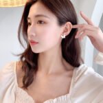 Layered Mother of Pearl Butterfly 2-Piece Set in gold plating. The set includes a pendant necklace and stud earrings, each featuring a dimensional butterfly with MOP wings and a center CZ stone.