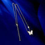 Layered Mother of Pearl Butterfly 2-Piece Set in gold plating. The set includes a pendant necklace and stud earrings, each featuring a dimensional butterfly with MOP wings and a center CZ stone.