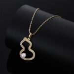 Wholesale Neo-Chinese Gourd Pearl Jewelry Set (Hulu shape), featuring hollowed-out metalwork, elegant pearls, includes matching stud earrings, necklace, and ring, a light luxury advanced sense accessory set from junejewelry.com.
