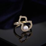 Wholesale Neo-Chinese Gourd Pearl Jewelry Set (Hulu shape), featuring hollowed-out metalwork, elegant pearls, includes matching stud earrings, necklace, and ring, a light luxury advanced sense accessory set from junejewelry.com.