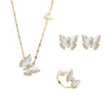 Wholesale Butterfly Shell Jewelry Set shown in gold and silver colors. The elegant set includes a butterfly pendant necklace, stud earrings, and an adjustable ring, all featuring iridescent Mother of Pearl wings and micro-paved Cubic Zirconia accents.