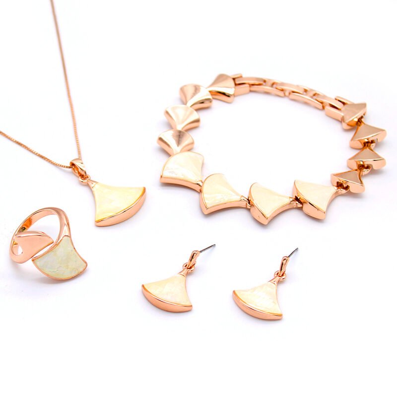 Wholesale Shell Fan Jewelry Set including necklace, bracelet, earrings, and ring with mother-of-pearl fan shapes in rose gold plating from JuneJewelry.com – unique fashion jewelry for bulk orders.