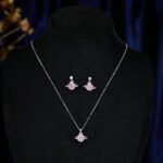 New Light Luxury Saturn Pendant Necklace Earrings Set, copper metal plated with white gold, featuring an exquisite planet charm. Ideal Clavicle Chain and matching earrings with an advanced, sophisticated aesthetic.