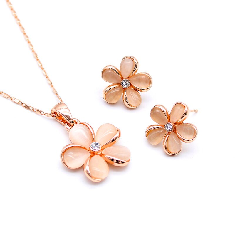 Wholesale rose gold flower jewelry set with cat eye stone and cubic zirconia stud earrings and necklace from JuneJewelry.com – unique high-quality fashion accessories for bulk buyers.