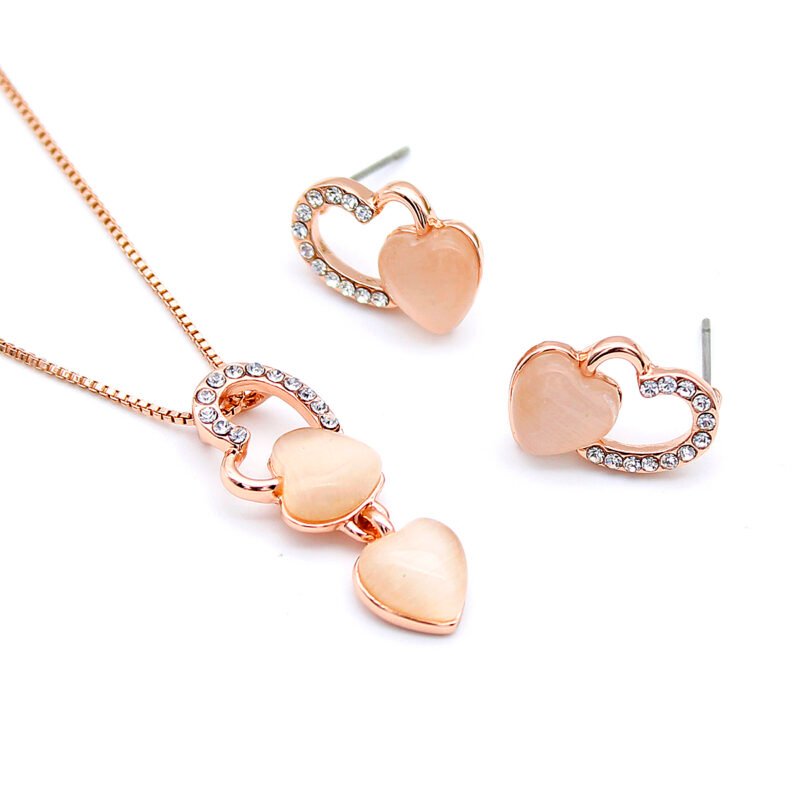 Wholesale Double Heart Cat Eye Set with CZ accents and pink cat eye stone in rose gold plating from JuneJewelry.com – unique, cheap high quality fashion jewelry for bulk sale.