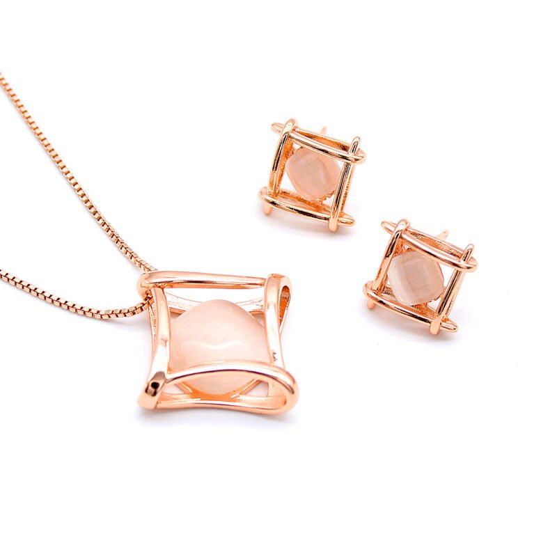 Wholesale Hourglass Cat Eye Set with round milky stone inside a geometric cage in rose gold plating from JuneJewelry.com – modern fashion jewelry for bulk orders.