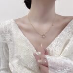 Geometric shell and cubic zirconia necklace and earrings jewelry set plated with 18K gold – luxury wholesale jewelry for women.