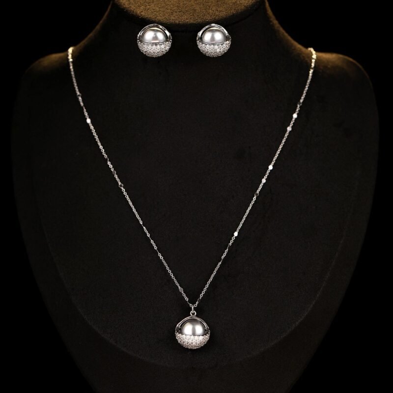 Wholesale Pearl Zircon Half Ball Set showing both the Rose Gold Plated version (Champagne Pearl) and the Silver Plated version (Gray Pearl) on black display mannequins.